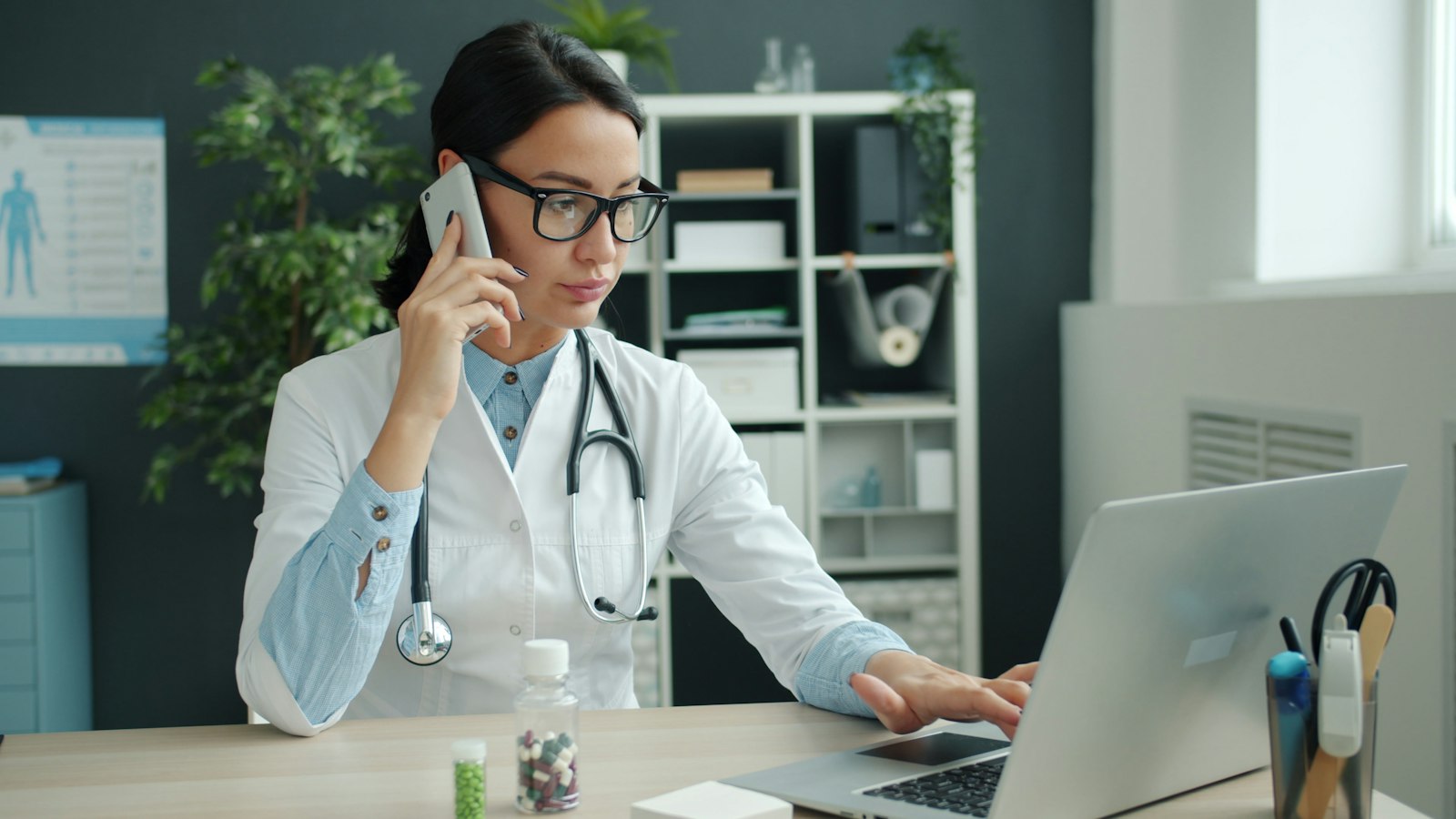 Female medical provider talking on the phone with a patient during a remote chronic care management check-in